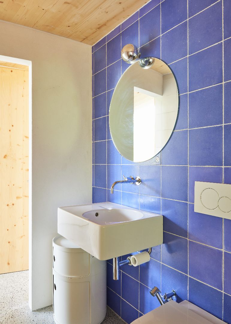 15 Casa Cometa Space Rental Interior Bathroom vertical with blue tiles and sink and kartell componibili storage